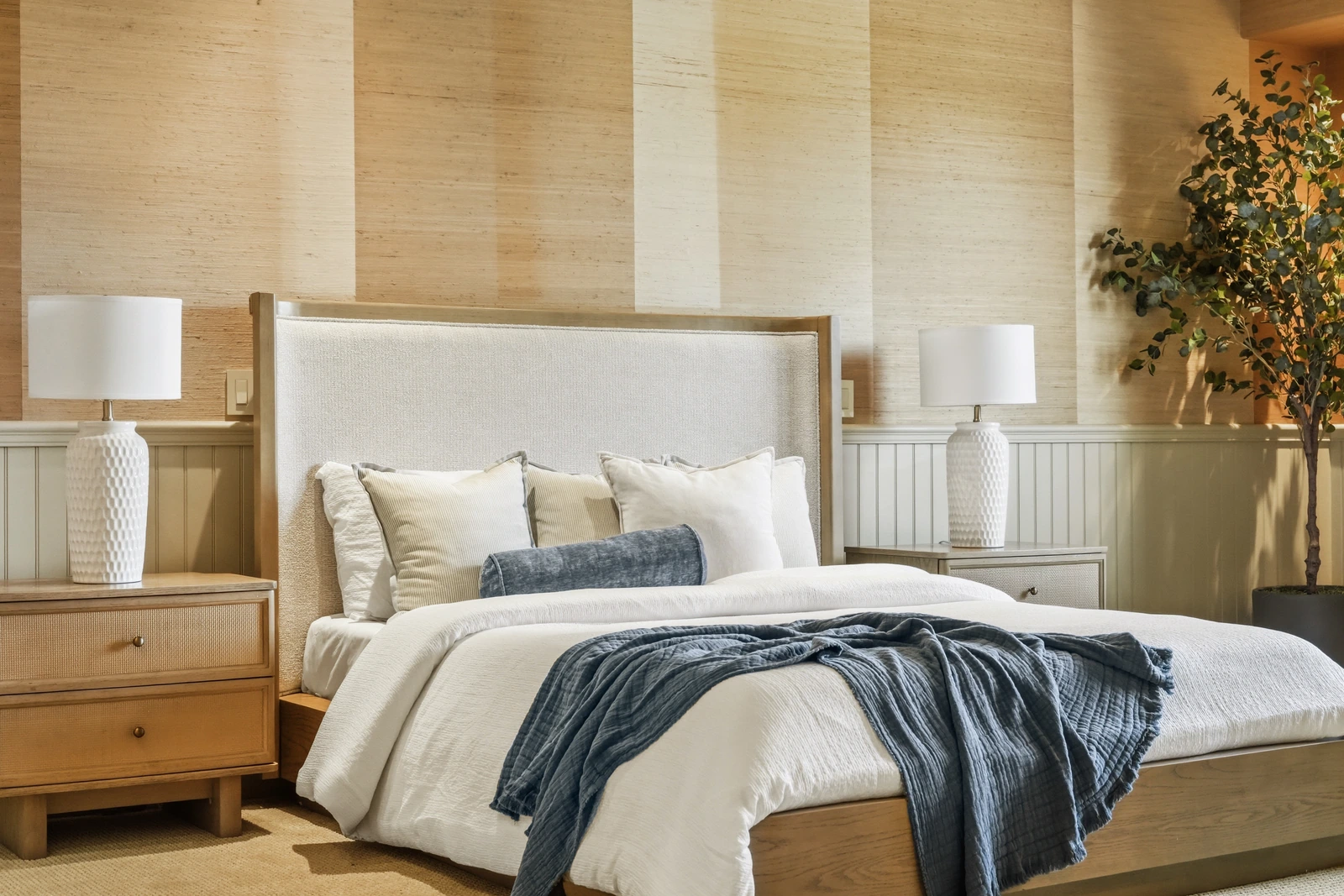 Textured bedroom with grasscloth walls and soft natural light